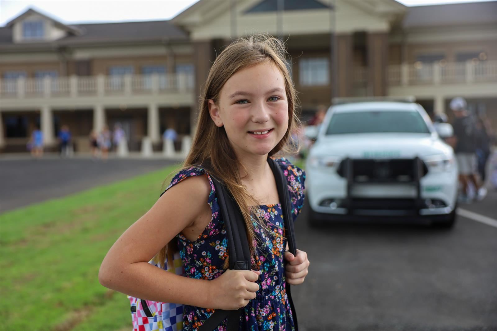 girl in front of school